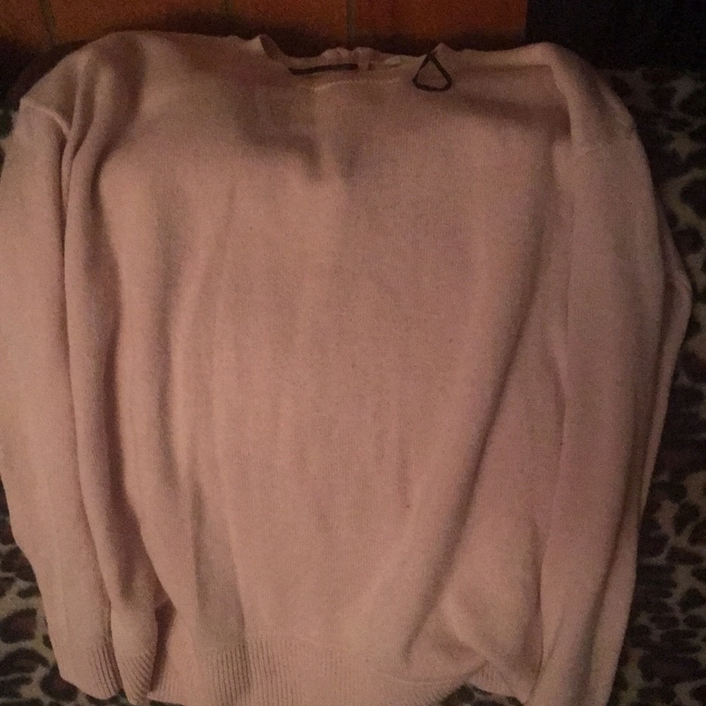 It’s a light pink sweater from H&M